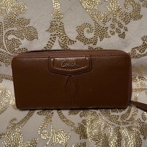Brown coach wallet.